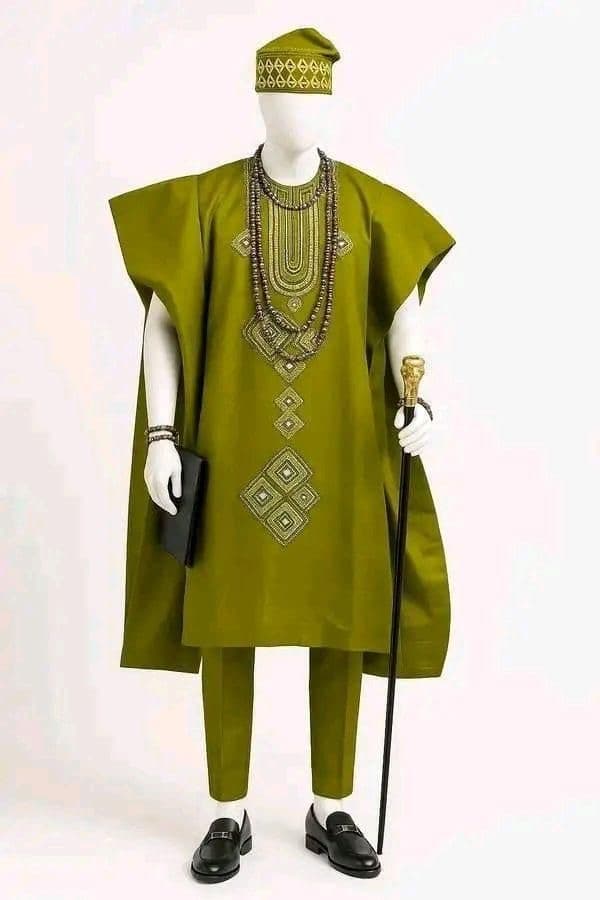 Olive green embellished agbada displayed on mannequin