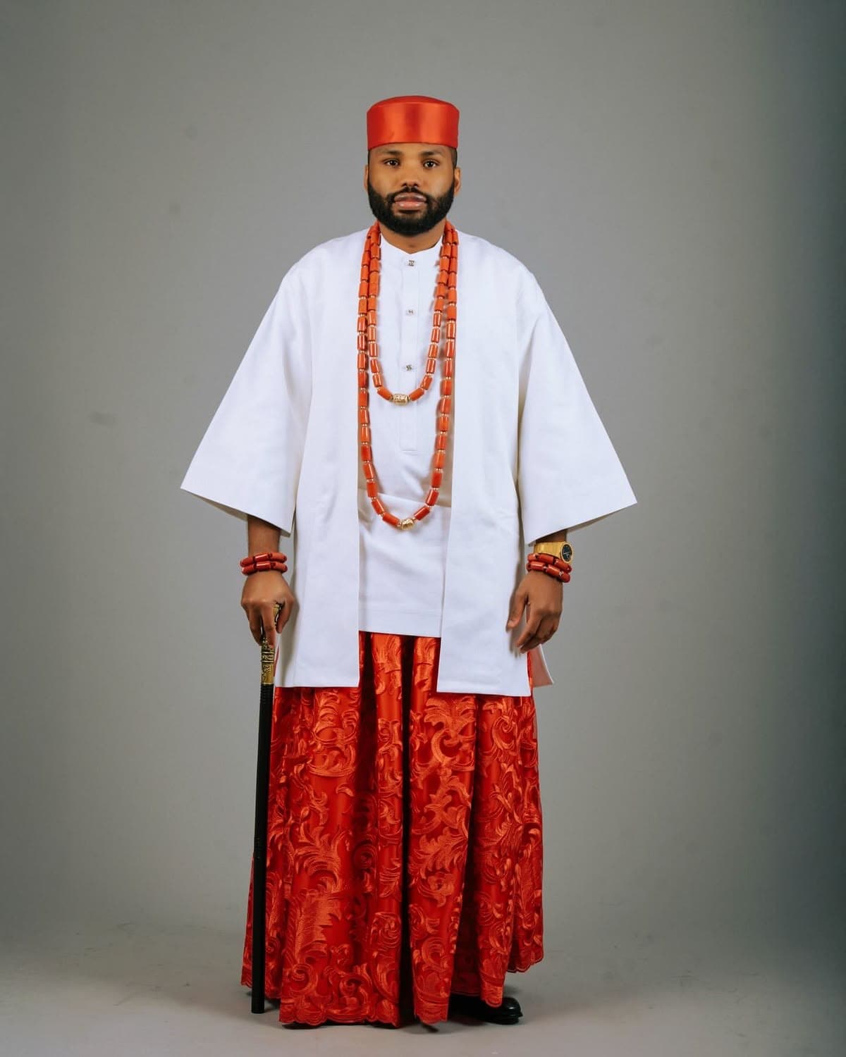 Man in white and red Igbo-inspired ceremonial attire