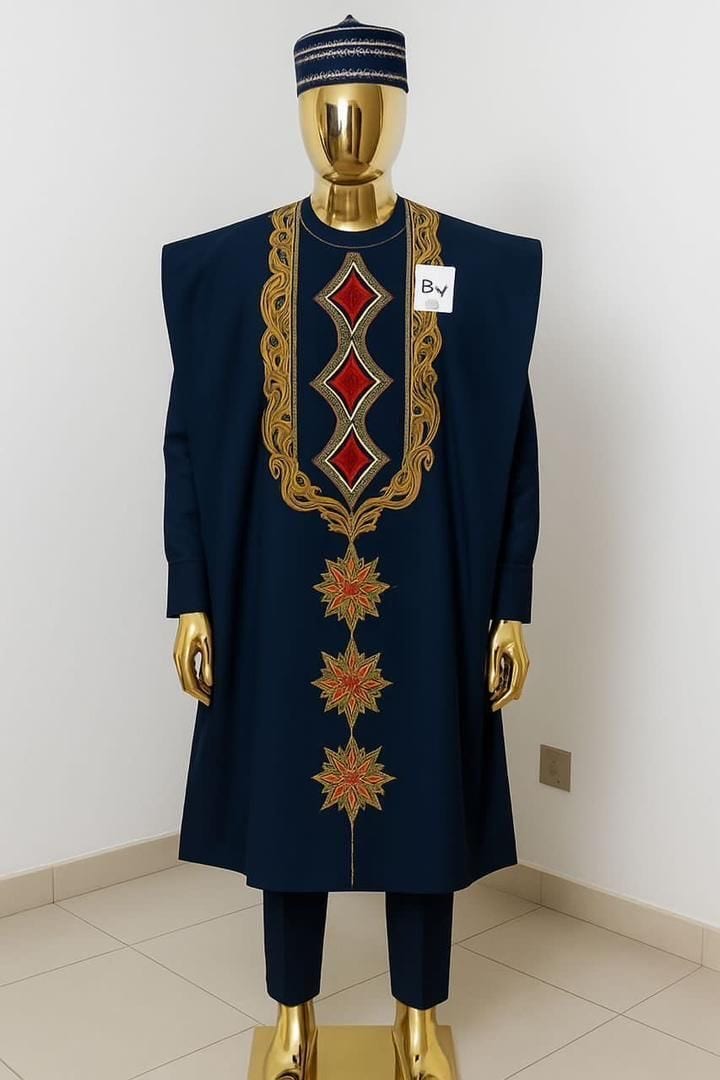 Navy blue traditional men's outfit with gold and red embroidery displayed on a mannequin